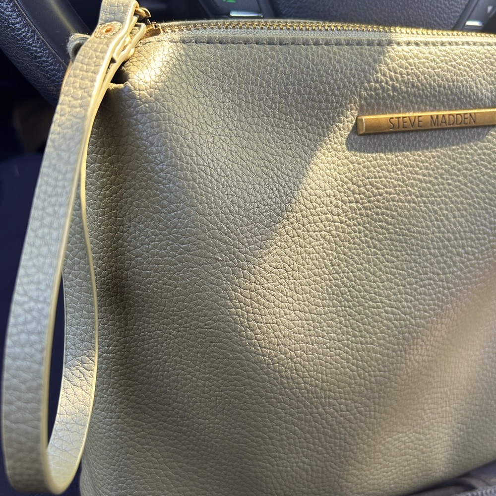 Women’s olive green large Steve Madden clutch with wristlet.